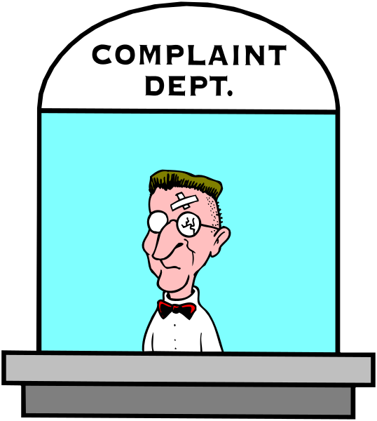 The cartoon shows a man with glasses standing behind an information desk labeled "COMPLAINT DEPT."