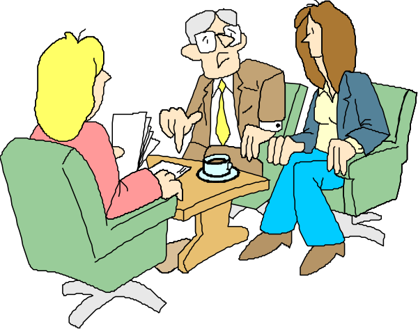 The cartoon shows a group of three adults sitting around a table with papers on it; two individuals appear to be engaged in conversation while one person is holding an object that looks like a cup of coffee.