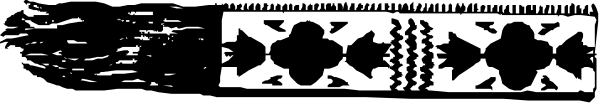 The image shows a black and white photo of an object with intricate patterns on it that resembles a piece of jewelry or decorative item.