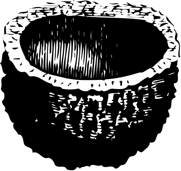 The black and white photo shows a close up of an object with textured surfaces that resemble teeth on top and bottom edges, giving it a jagged appearance; there is no visible background detail due to its focus on this item which appears to be in motion or being manipulated by some force as indicated by the blurred lines around it.