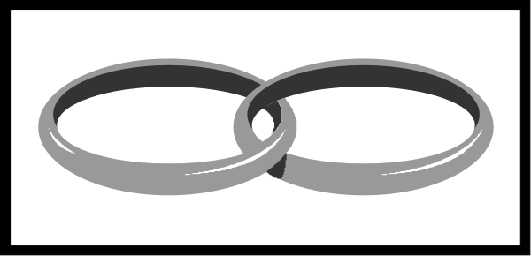 The image shows a pair of rings with two bands each placed on top of another ring set against an unadorned background that resembles a white wall within what appears to be a room corner.