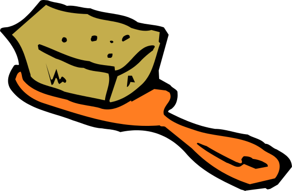 The image shows a piece of cheese with an orange ribbon around it on top of what appears to be a black surface against a dark background.