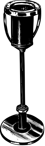 The black and white photo shows a wine glass with an intricate stem design on it.