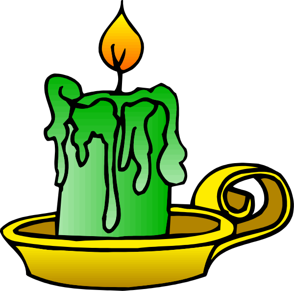 The image shows a candle with melted wax dripping from it inside an illuminated lamp that is part of a diwali decoration on top of what appears to be a scroll-like object resembling a traditional Indian rangoli design, all set against a black background.