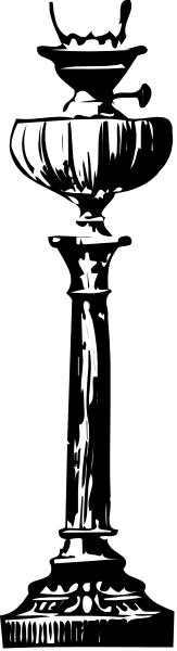 The black and white photo shows a tall trophy with multiple levels of detail on its surface placed against an out-of-focus background that appears to be indoors due to lighting conditions.
