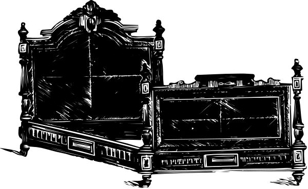 The black and white photo shows a large bed with an intricate headboard placed on top of it against what appears to be a dark background.