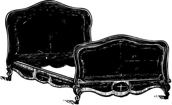 The black and white photo shows two vintage sofas with intricate designs on a dark background.
