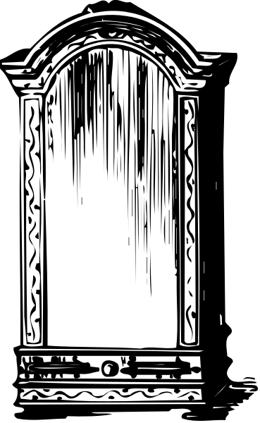 The black and white photo shows a door with an intricate design on it against a dark background.