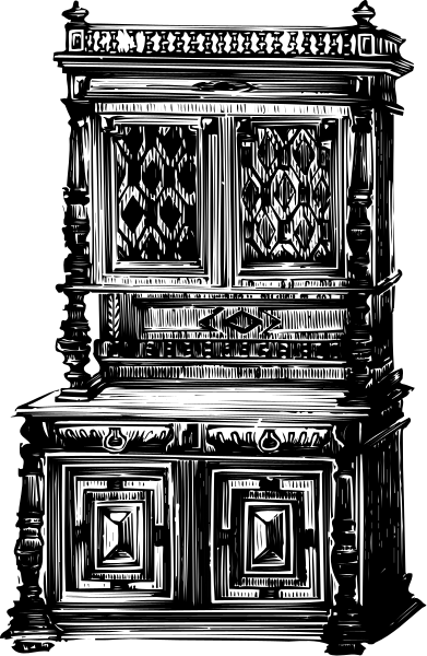 The black and white photo shows a wooden cabinet with intricate designs on its doors against an indistinct background.