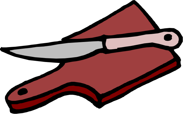 The image shows a pair of scissors with red handles placed on top of an open book that is lying flat.