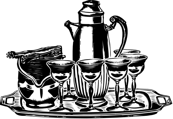 The black and white photo shows a table with various items on it including cups, bowls, bottles of wine glasses, and what appears to be an instrument in one corner.