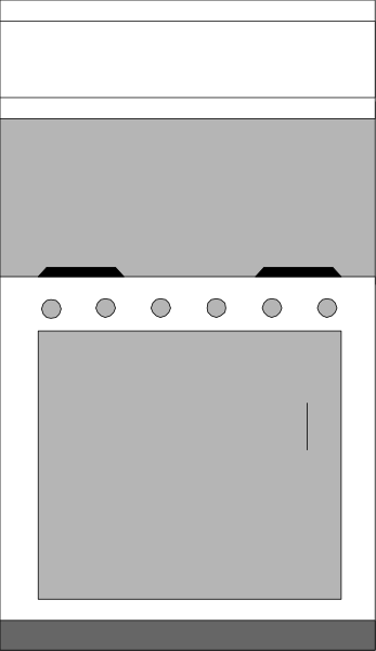 The image shows a gray oven with white knobs inside an open kitchen area that has no other visible elements such as countertops or cabinets.