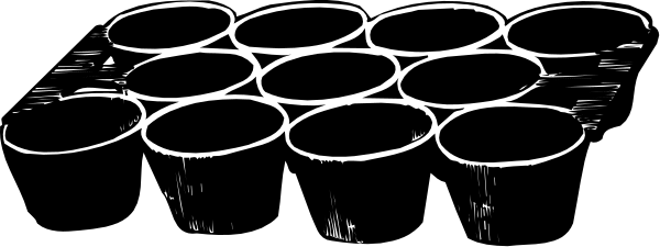 The image shows a black and white photo of an object with circular patterns on it placed against a dark background.