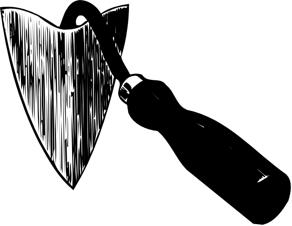 The black and white photo shows a close up of an object with intricate details that resemble metalwork or machinery parts against a dark background.